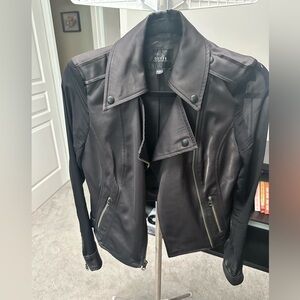 Faux leather looking coat with sheer sleeves. Guess brand size xs